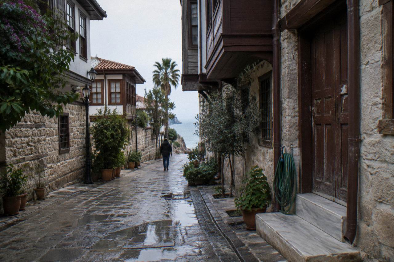 Narrow stone-paved street in Kaleici old town with historic houses on both sides