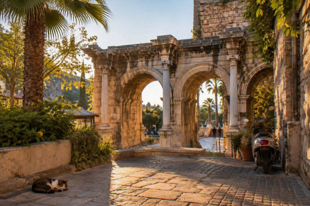 Hadrian's Gate stone arches seen from a Kaleici street in Antalya