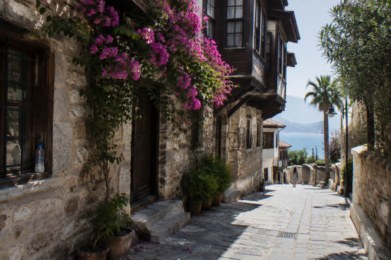 Narrow old town street with stone houses in Kaleici, Antalya