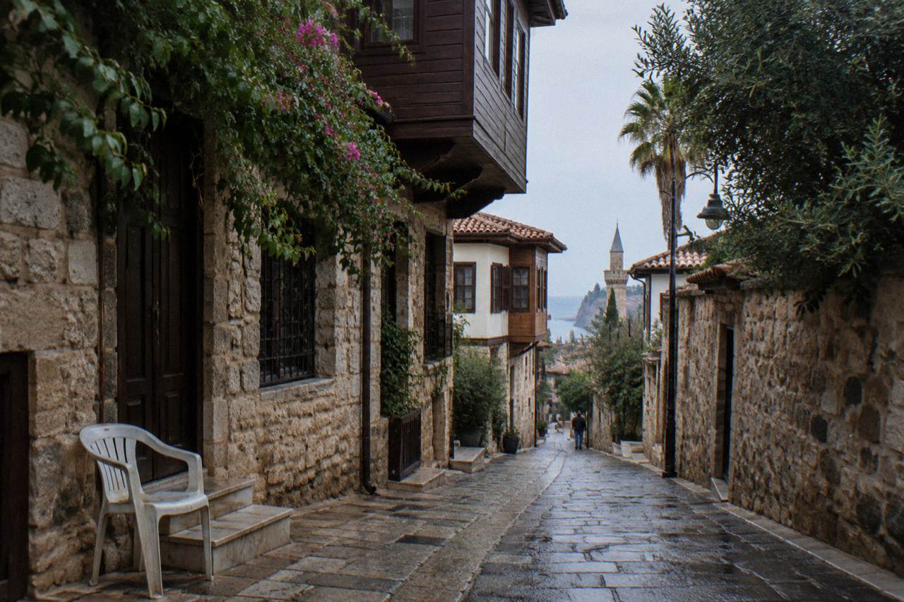 A narrow lane in Kaleici old town with stone walls and wooden upper floors