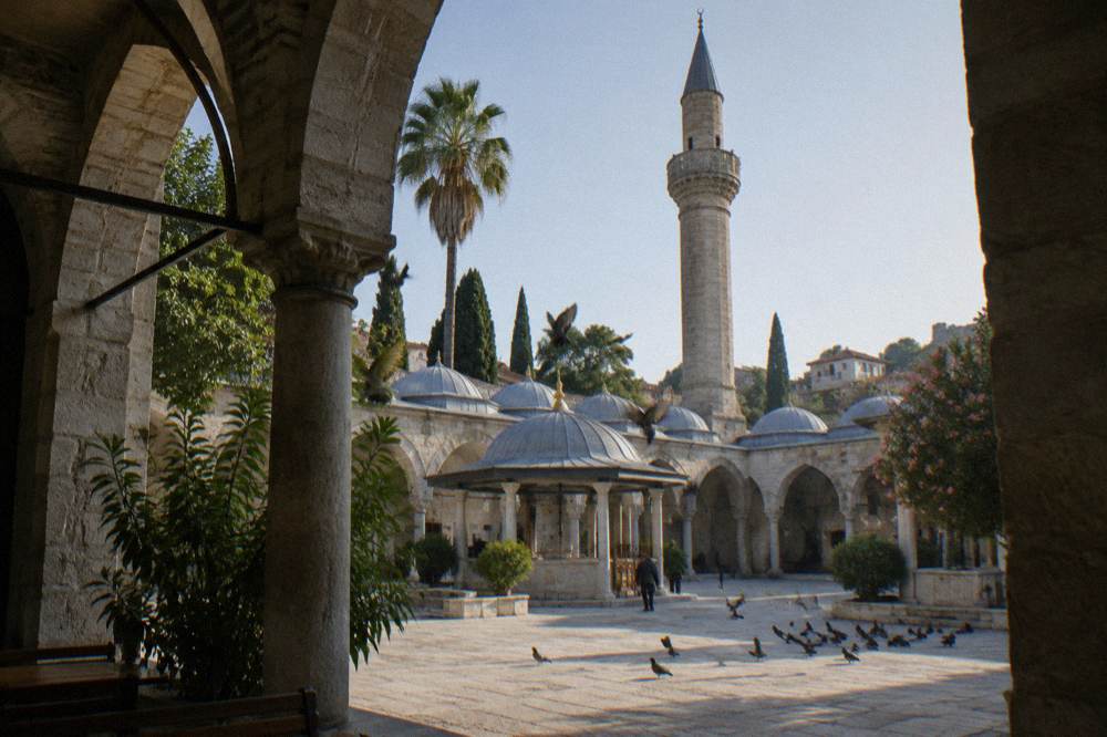 Stone minaret and mosque courtyard in the Kaleici old town