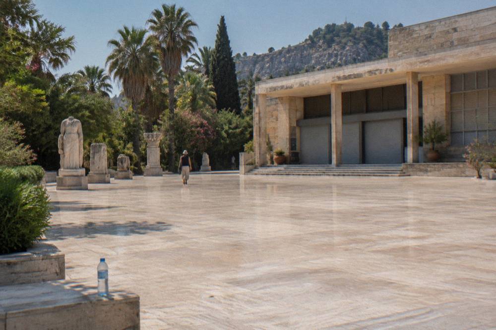 An empty museum plaza in Antalya with cleared ground and municipal buildings in the background
