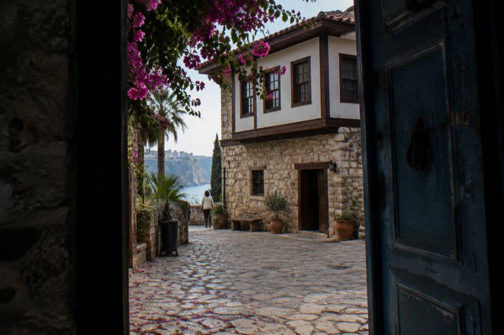 A restored stone building housing a small museum in the old town lanes of Antalya