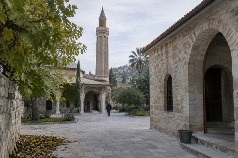 Courtyard of a stone museum building in Antalya with arched doorways