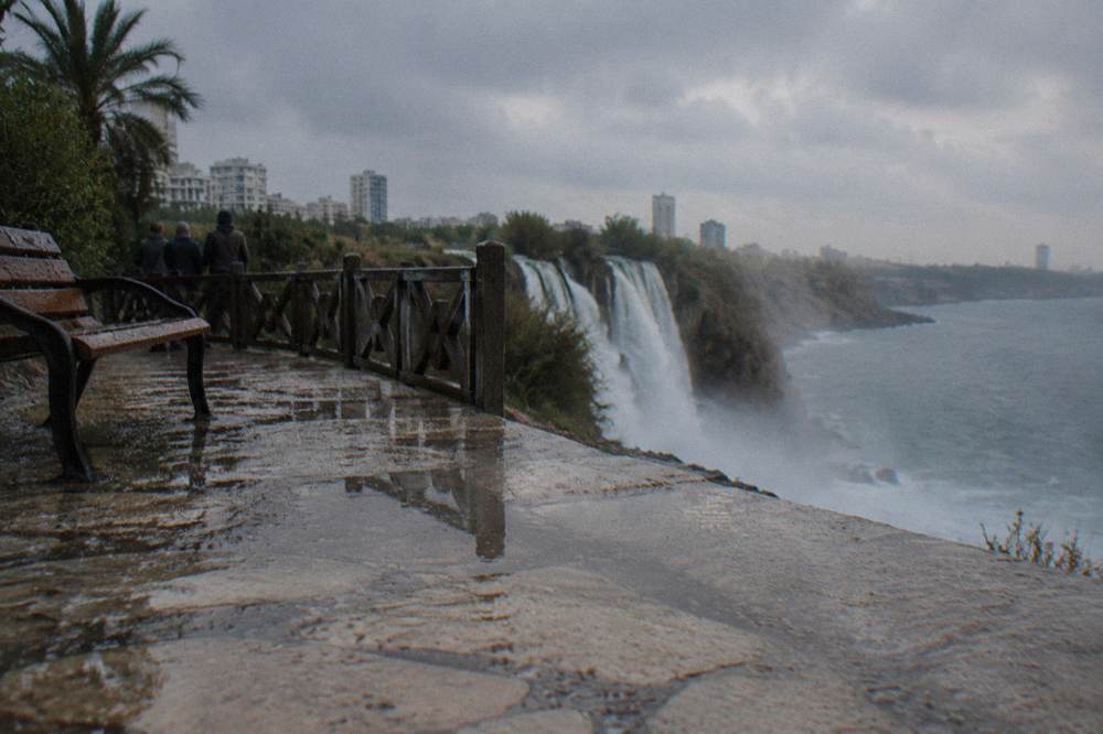 A stone viewing terrace on a cliff above falling water