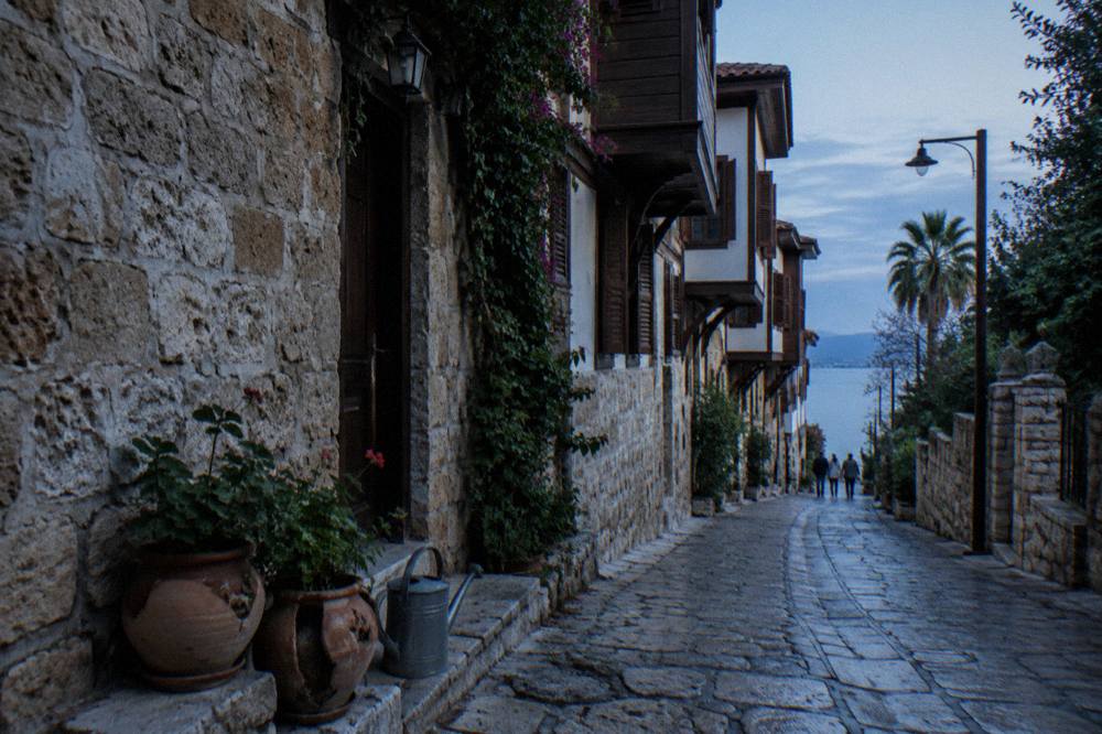 Narrow stone lane in Kaleici old town with shuttered houses