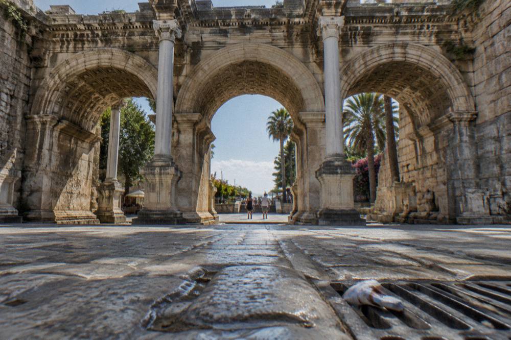 The three stone arches of Hadrian's Gate from the street in Kaleici